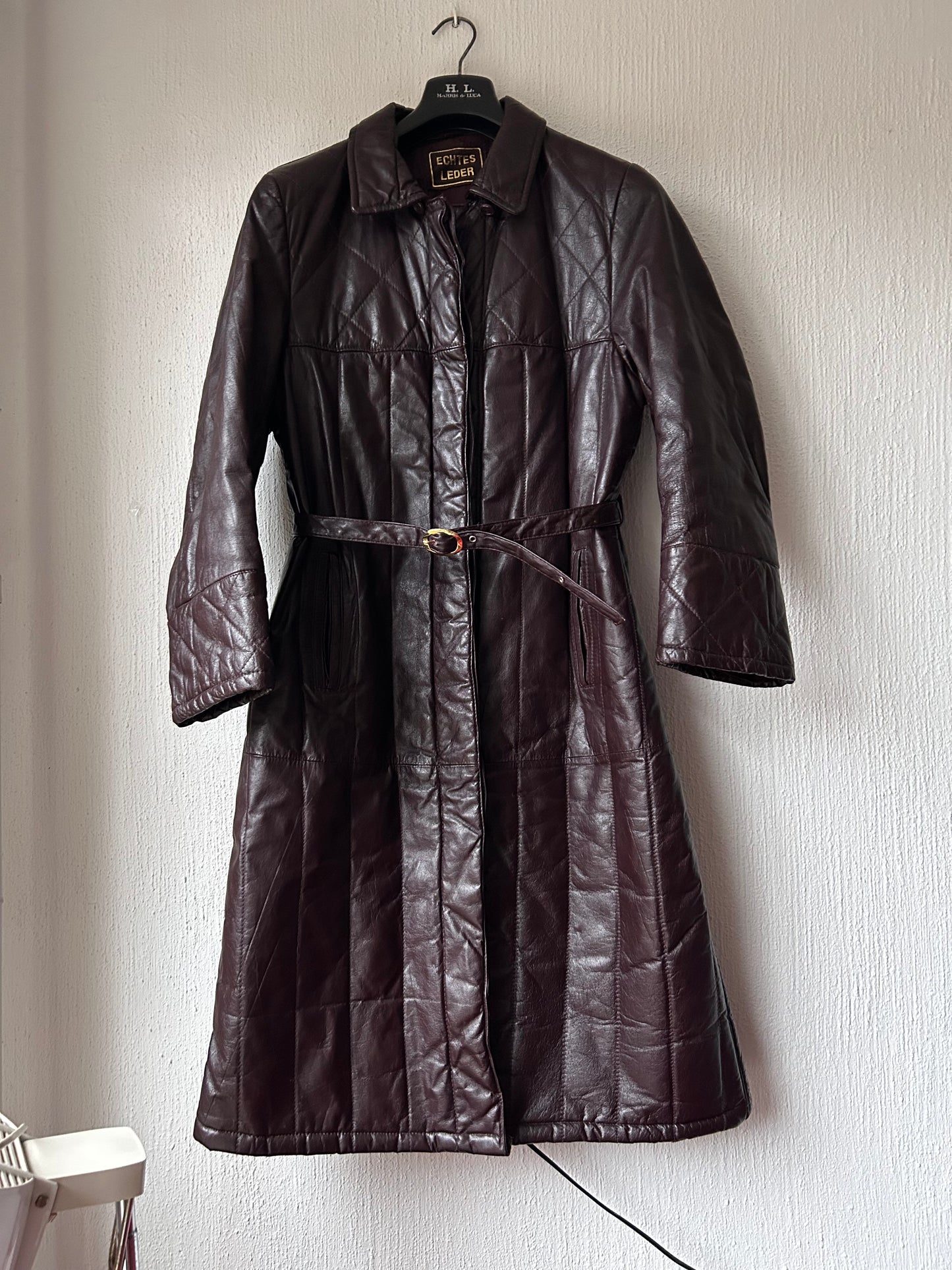 Leather trench coat with padded lining