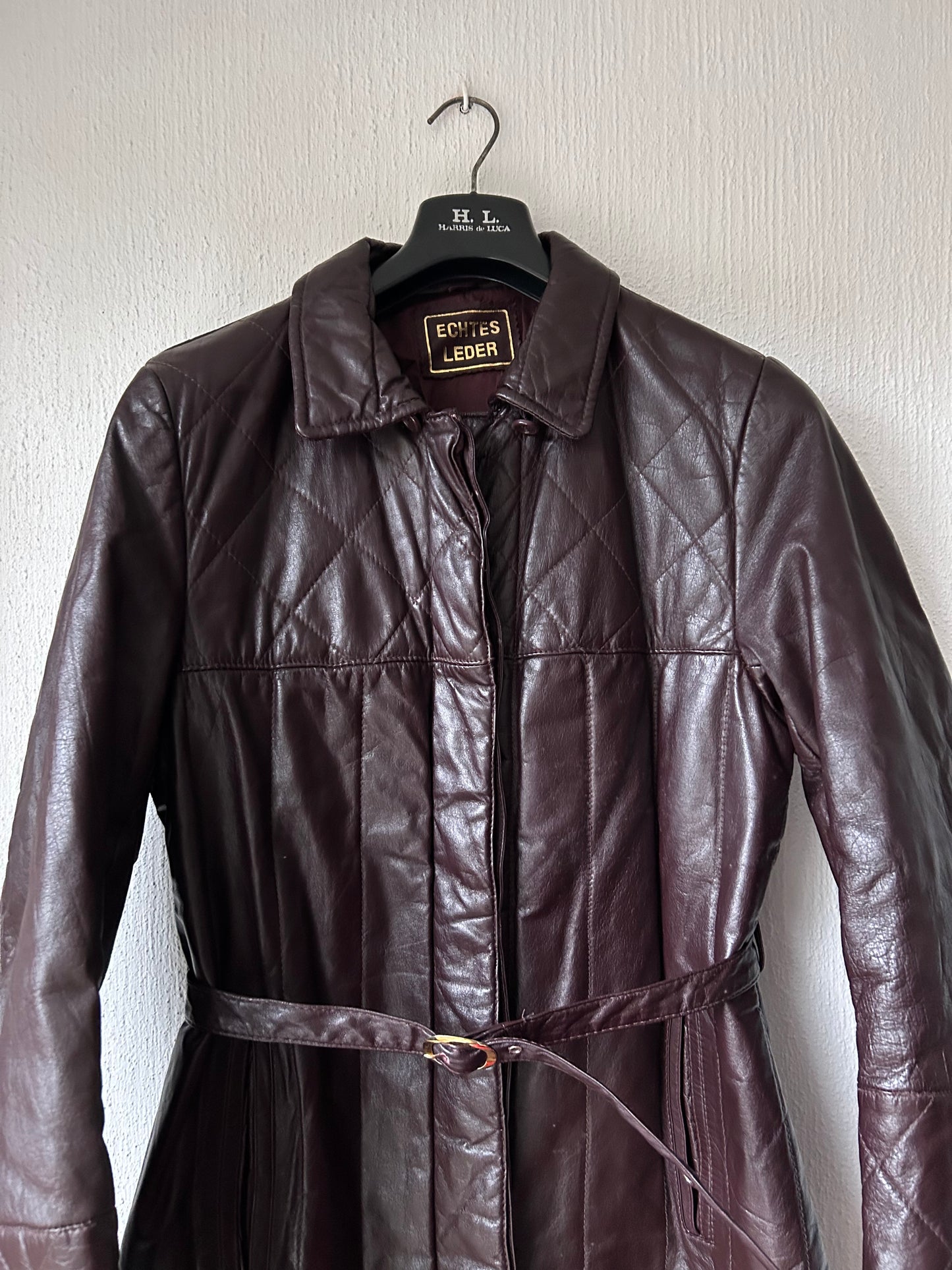 Leather trench coat with padded lining