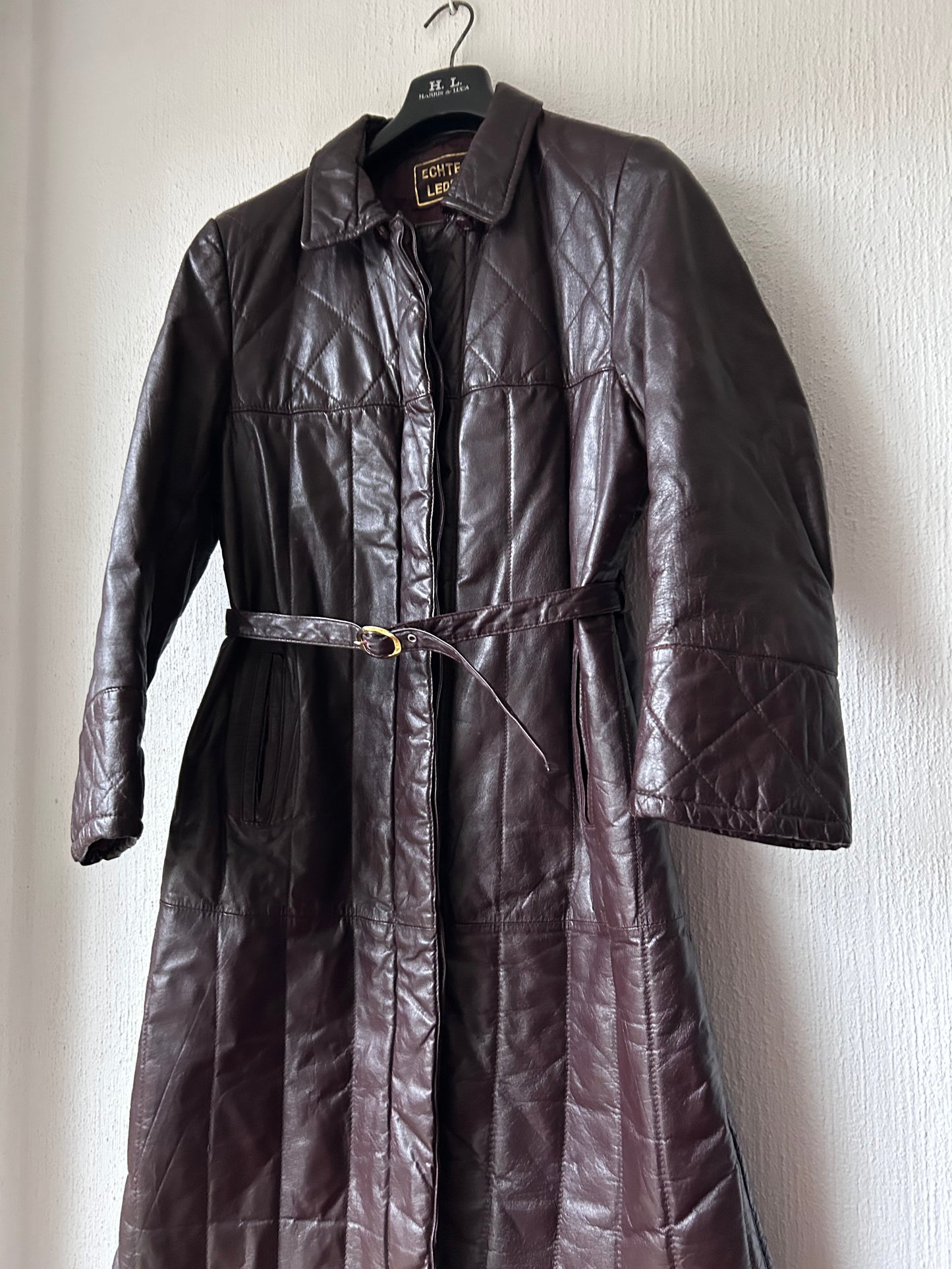 Leather trench coat with padded lining