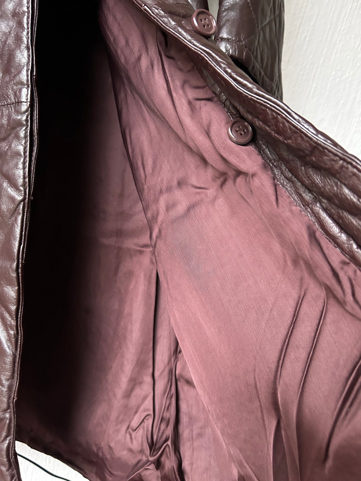 Leather trench coat with padded lining