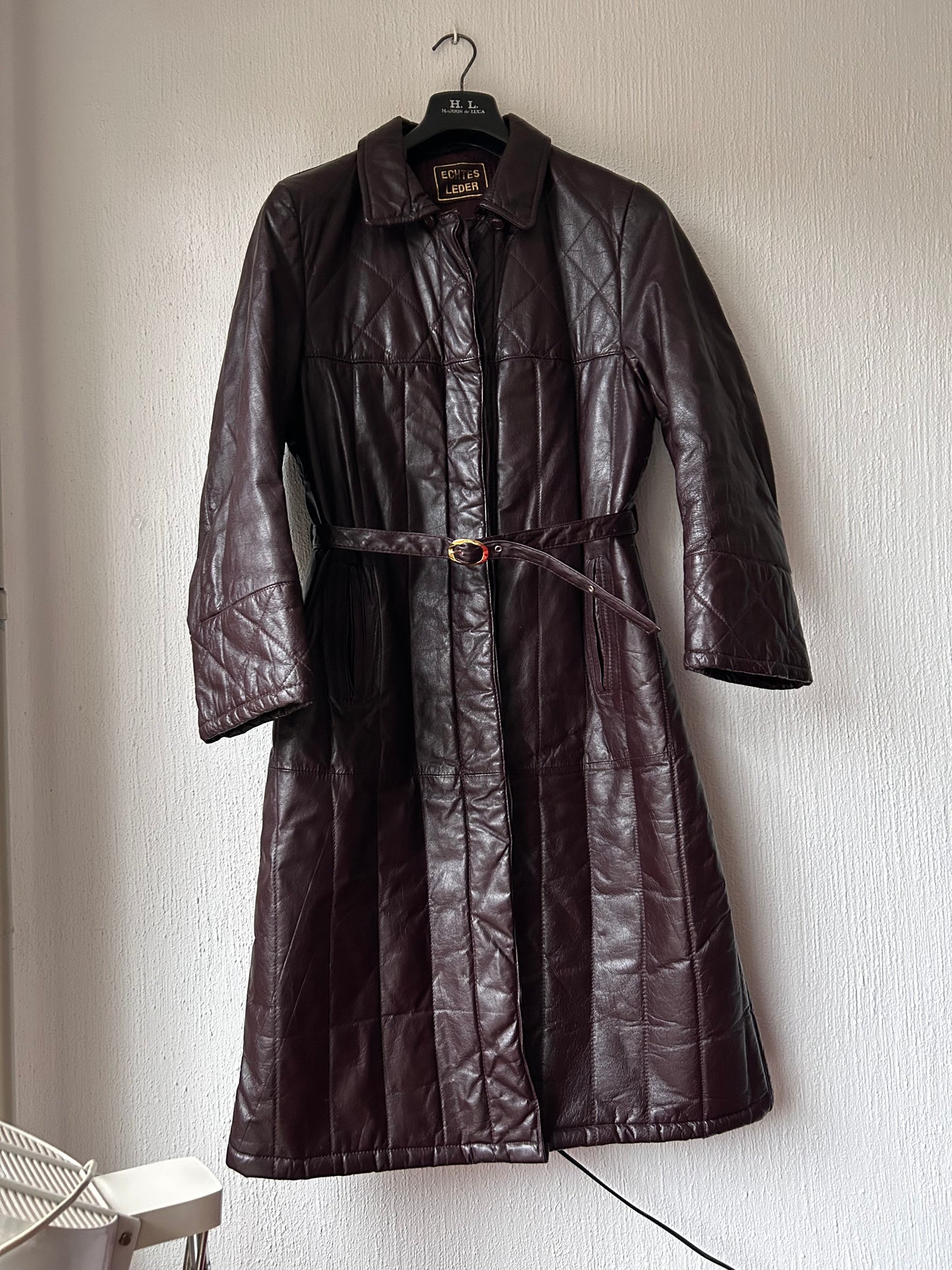 Leather trench coat with padded lining